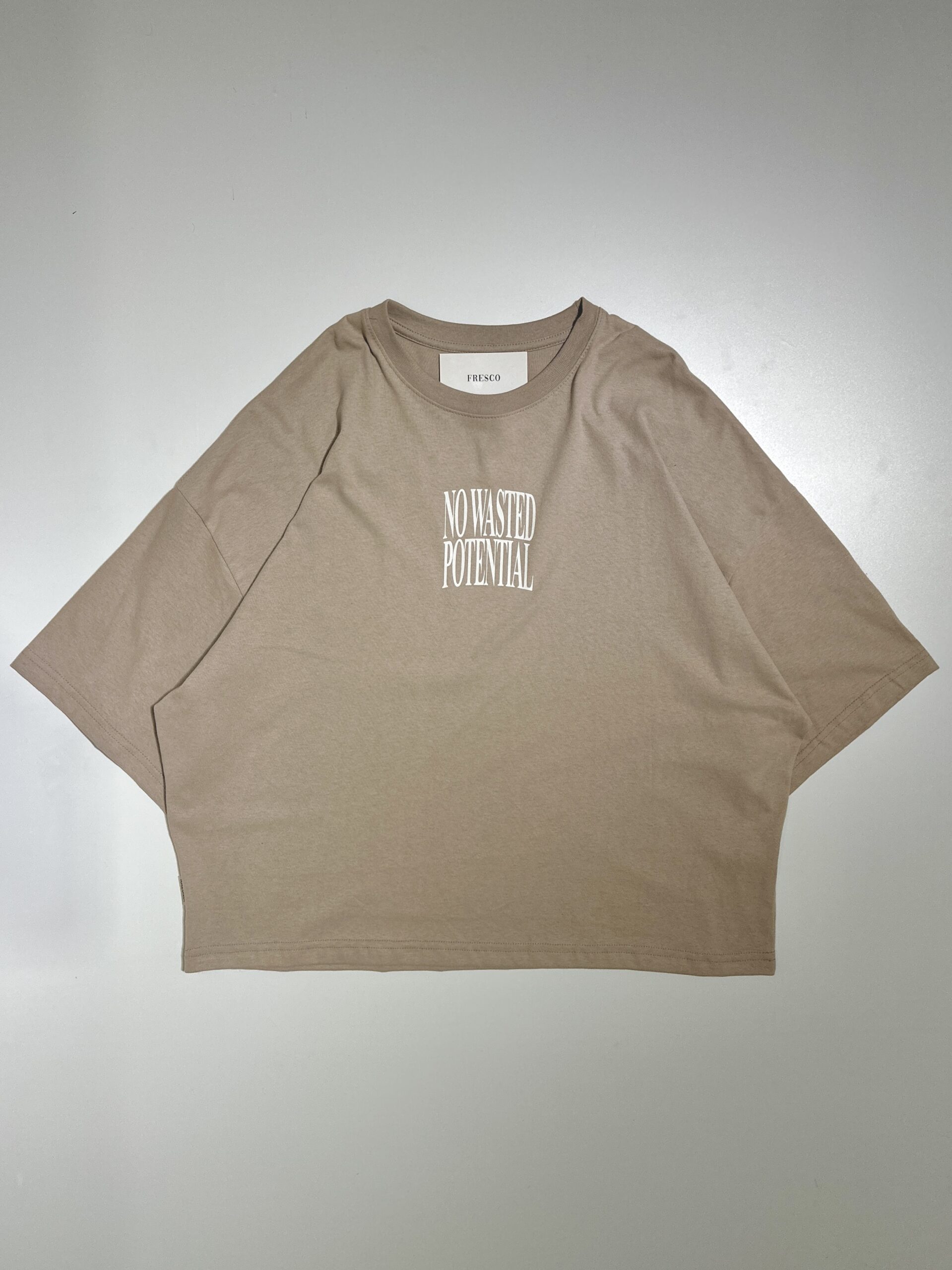 REMERA BOXY NOT WASTED TAUPE